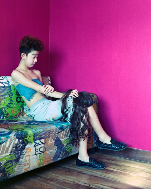 Ronghui Chen, Freezing Land, portrait against a pink wall
